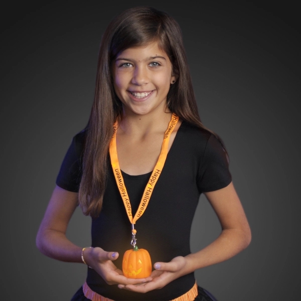 Little Girl Wearing Light Up Pumpkin Happy Halloween Lanyard